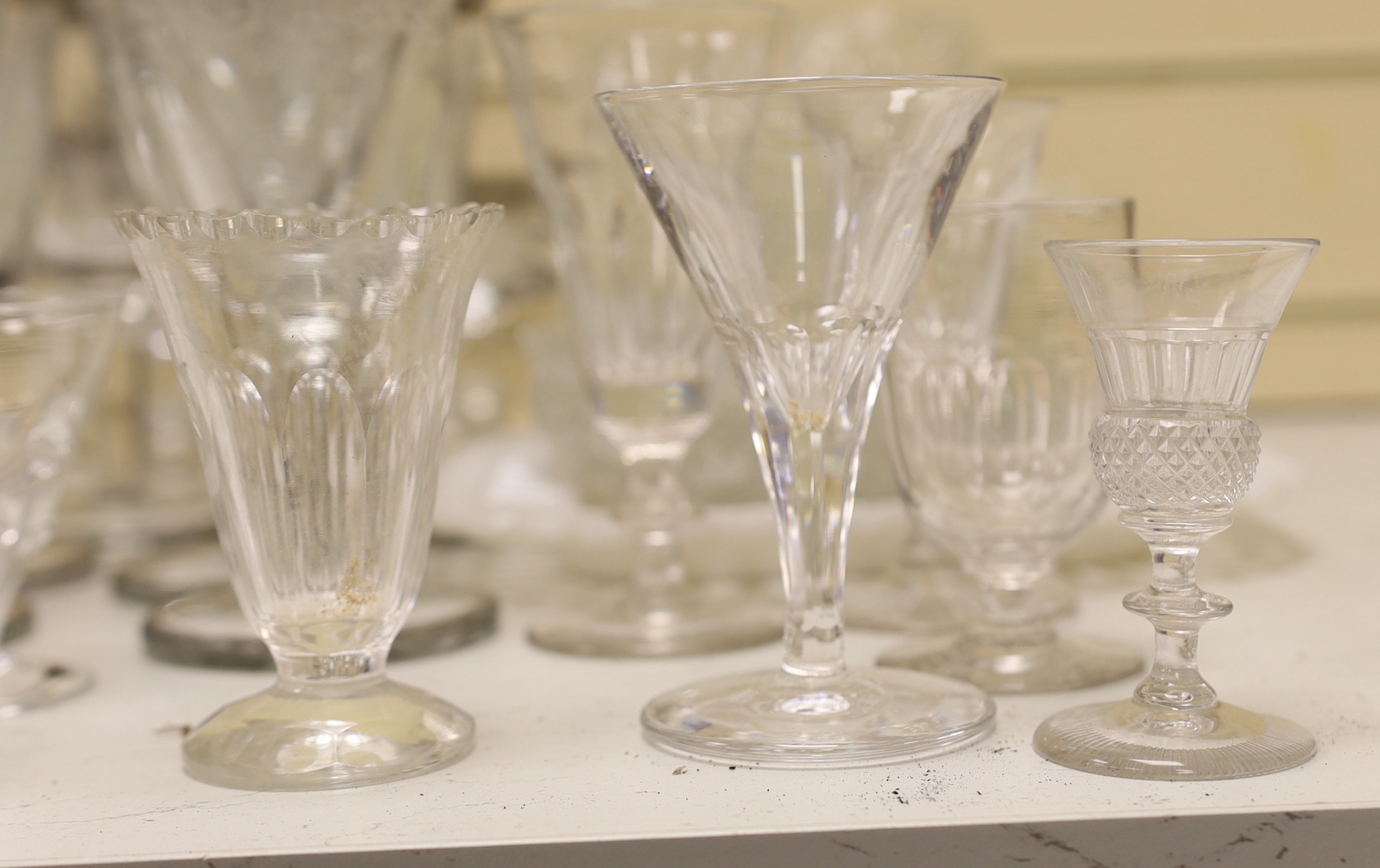 A part suite of etched and silver banded wine glasses together with other glassware